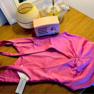 Sweet pink bathing suit. Tags on.